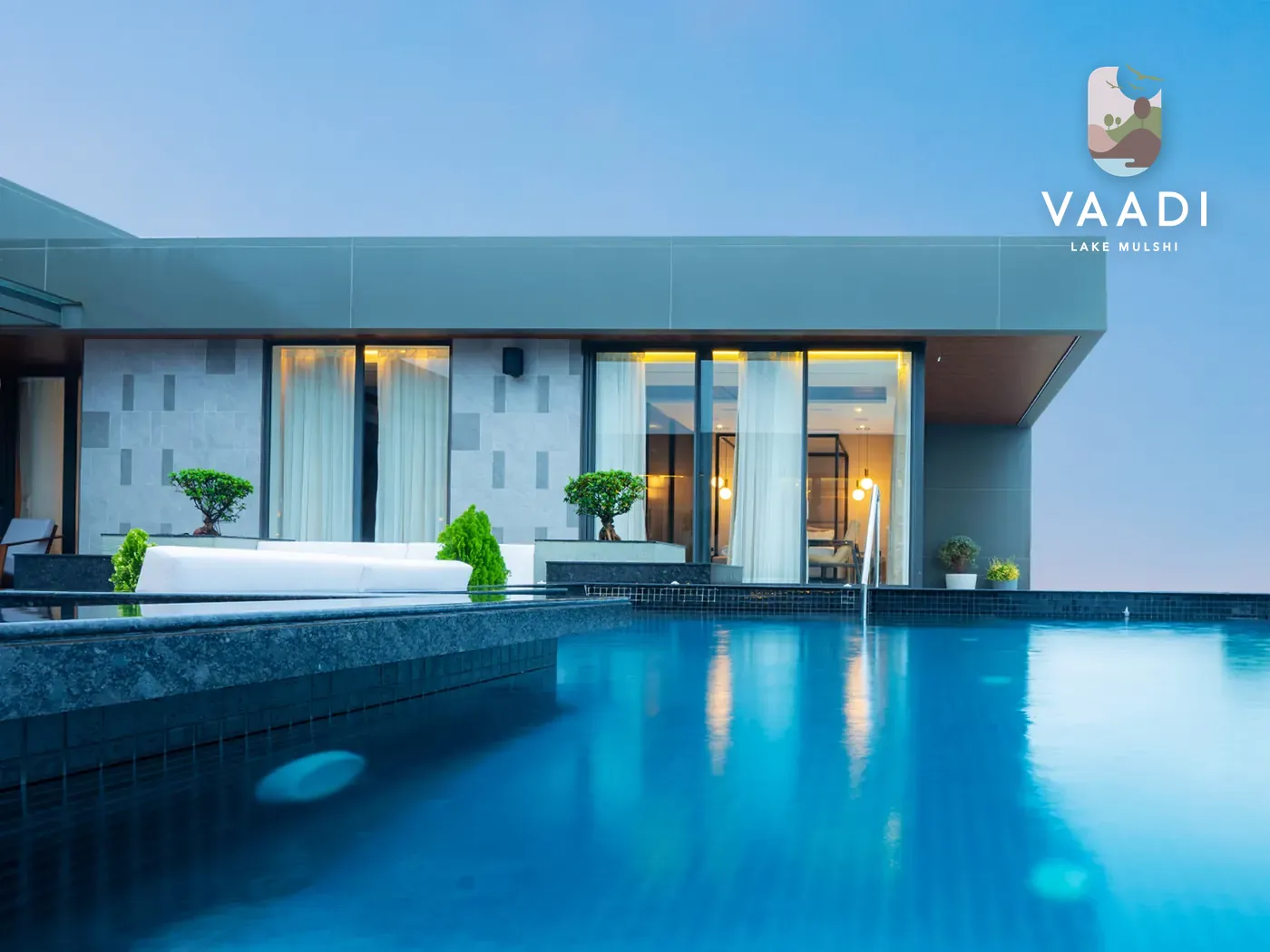 Vaadi villa with infinity pool and the Vaadi logo
